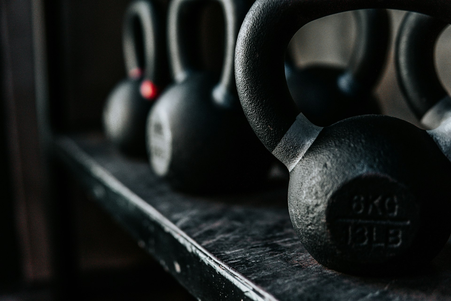 black kettle bell on black metal bar